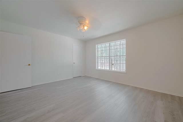 6103 Fondren Rd Unit 7, Houston, TX 77036 - empty room featuring wood finished floors, a ceiling fan, and baseboards