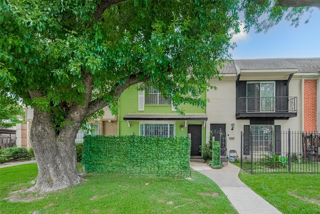 6103 Fondren Rd Unit 7, Houston, TX 77036 - townhome / multi-family property with brick siding, roof with shingles, and a balcony