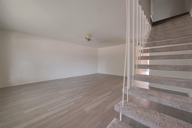 6103 Fondren Rd Unit 7, Houston, TX 77036 - stairs featuring wood finished floors and baseboards
