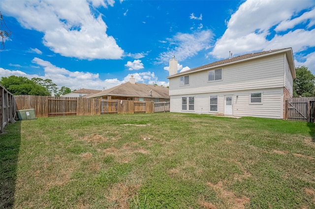 5011 Bridgecrossing Ct, Spring, TX 77379 - back of house featuring a chimney