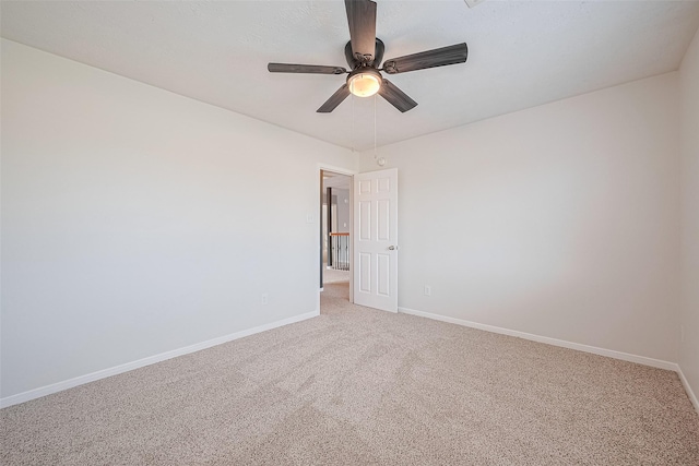 5011 Bridgecrossing Ct, Spring, TX 77379 - empty room featuring baseboards, light carpet, and ceiling fan