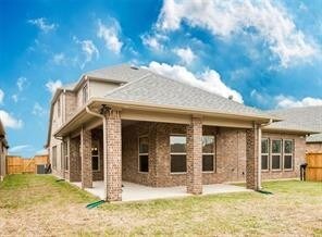 2334 Twin Rose Dr, Missouri City, TX 77459 - back of property with a patio area