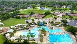 2334 Twin Rose Dr, Missouri City, TX 77459 - drone / aerial view of a pool area and a large body of water