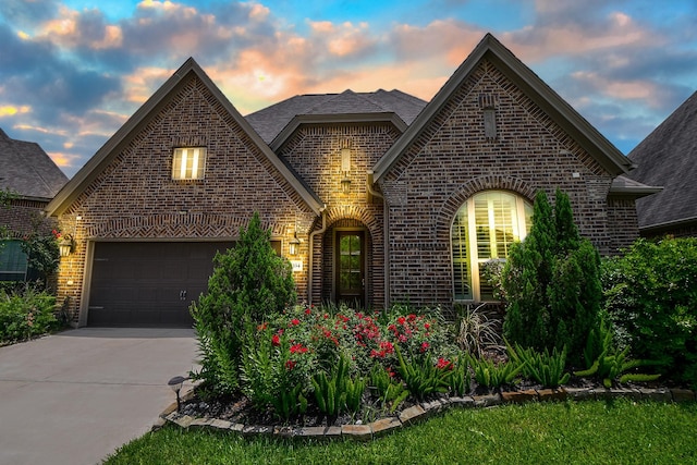 2334 Twin Rose Dr, Missouri City, TX 77459 - view of front of property featuring brick siding, driveway, and a shingled roof