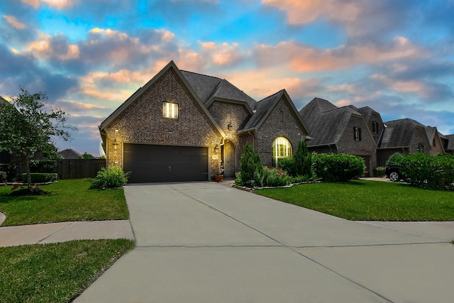 2334 Twin Rose Dr, Missouri City, TX 77459 - french country style house with concrete driveway and brick siding