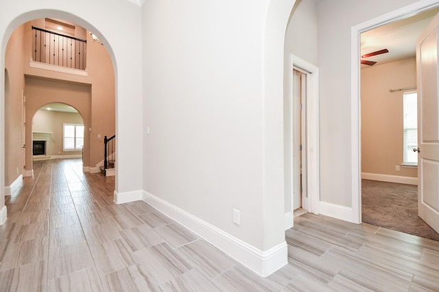 2334 Twin Rose Dr, Missouri City, TX 77459 - hall with arched walkways and baseboards