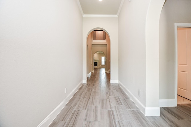 2334 Twin Rose Dr, Missouri City, TX 77459 - corridor with arched walkways, ornamental molding, light wood-type flooring, and baseboards