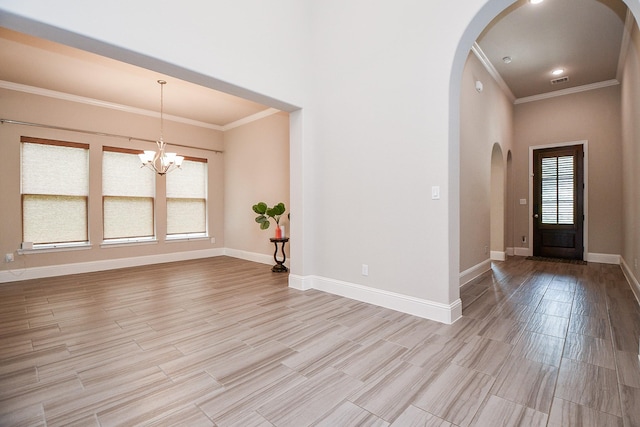 2334 Twin Rose Dr, Missouri City, TX 77459 - entryway featuring arched walkways, crown molding, baseboards, a chandelier, and light wood finished floors