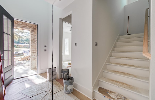 1802 Rollingwood Dr, Huntsville, TX 77340 - entryway featuring plenty of natural light, stairs, and light wood finished floors