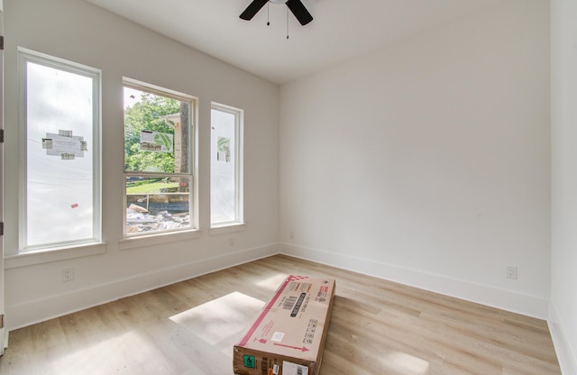 1802 Rollingwood Dr, Huntsville, TX 77340 - spare room featuring a ceiling fan, light wood-style floors, and baseboards