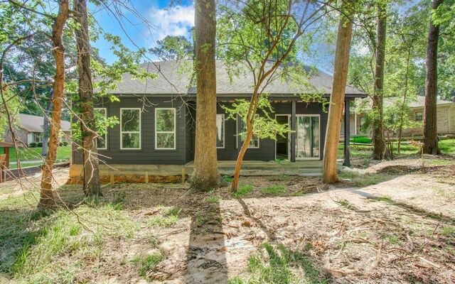 1802 Rollingwood Dr, Huntsville, TX 77340 - back of house featuring roof with shingles