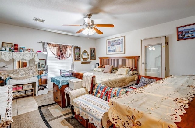 720 Red Oak Ave, Crosby, TX 77532 - bedroom with light tile patterned floors and ceiling fan