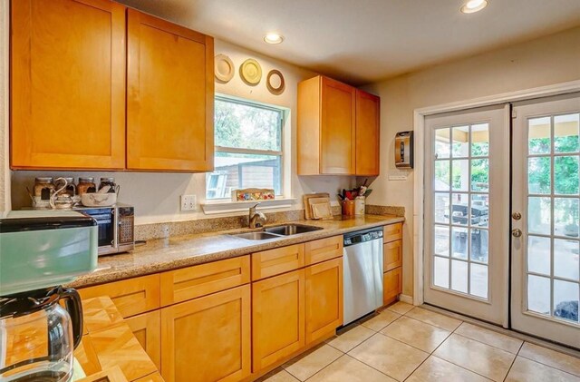 720 Red Oak Ave, Crosby, TX 77532 - kitchen with dishwasher, light countertops, a sink, light tile patterned floors, and recessed lighting