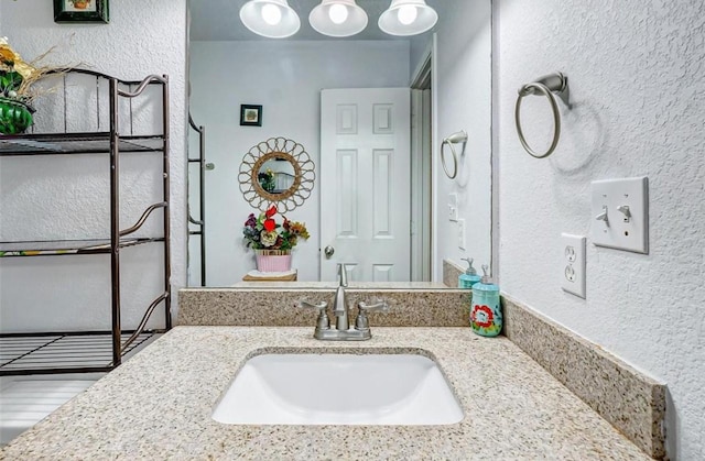 720 Red Oak Ave, Crosby, TX 77532 - bathroom with a textured wall and vanity