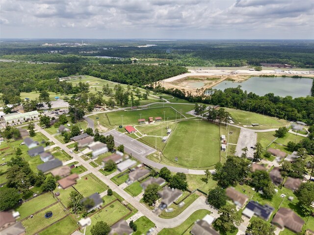 720 Red Oak Ave, Crosby, TX 77532 - aerial overview of property's location featuring a large body of water and a heavily wooded area