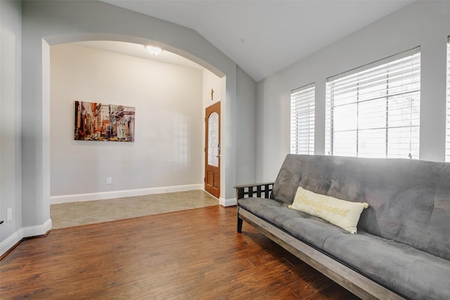 26622 Clear Mill Ln, Katy, TX 77494 - living area featuring arched walkways, vaulted ceiling, wood finished floors, and baseboards