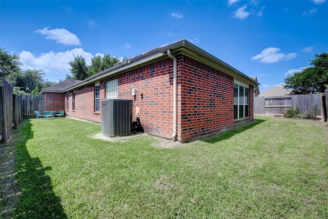 26622 Clear Mill Ln, Katy, TX 77494 - rear view of house with central AC unit and brick siding