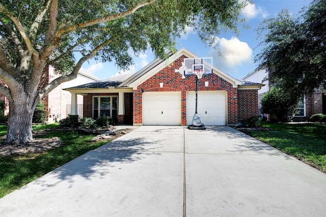26622 Clear Mill Ln, Katy, TX 77494 - view of front of house with brick siding, a garage, concrete driveway, and a front yard