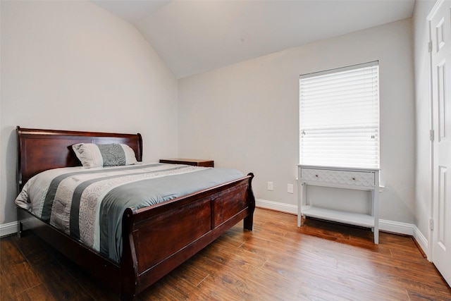 26622 Clear Mill Ln, Katy, TX 77494 - bedroom featuring wood finished floors, lofted ceiling, and baseboards
