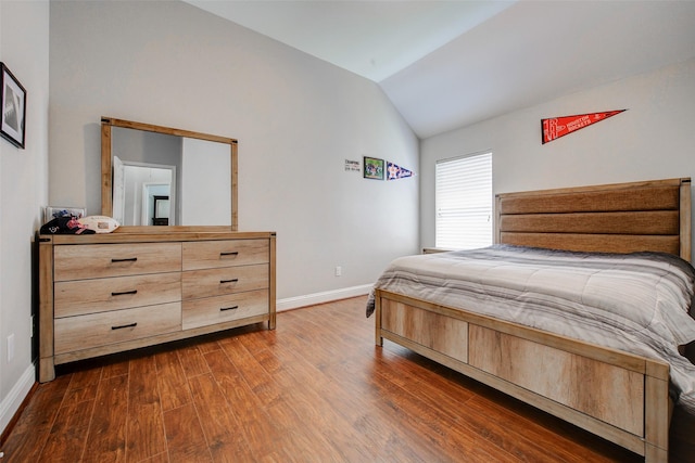 26622 Clear Mill Ln, Katy, TX 77494 - bedroom featuring lofted ceiling, baseboards, and dark wood finished floors
