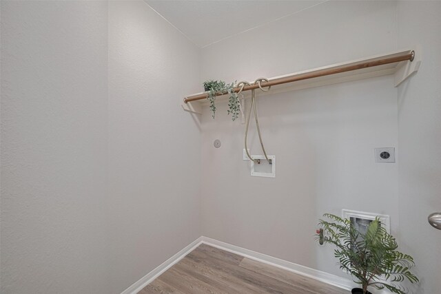 2810 Meadowbrook Ln, Rosenberg, TX 77471 - washroom with electric dryer hookup, hookup for a washing machine, light wood-style floors, and baseboards