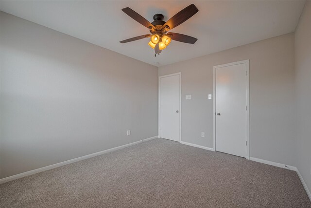 2810 Meadowbrook Ln, Rosenberg, TX 77471 - spare room with baseboards, carpet flooring, and a ceiling fan