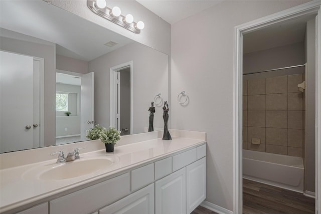 2810 Meadowbrook Ln, Rosenberg, TX 77471 - full bath with vanity, wood finished floors, and shower / washtub combination