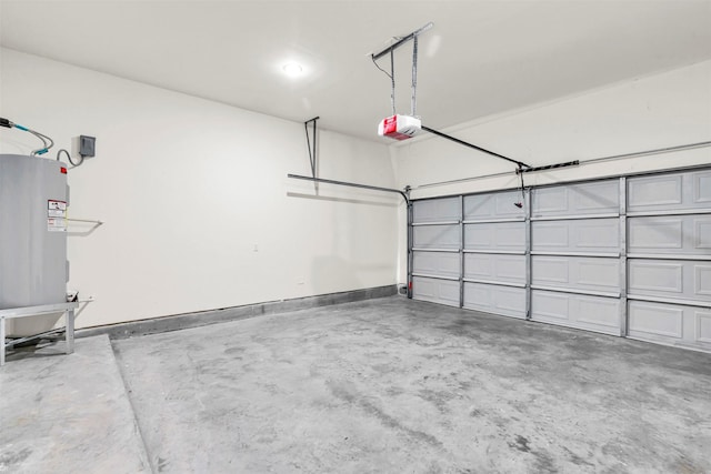 4908 Broom St, Houston, TX 77091 - garage featuring a garage door opener and baseboards