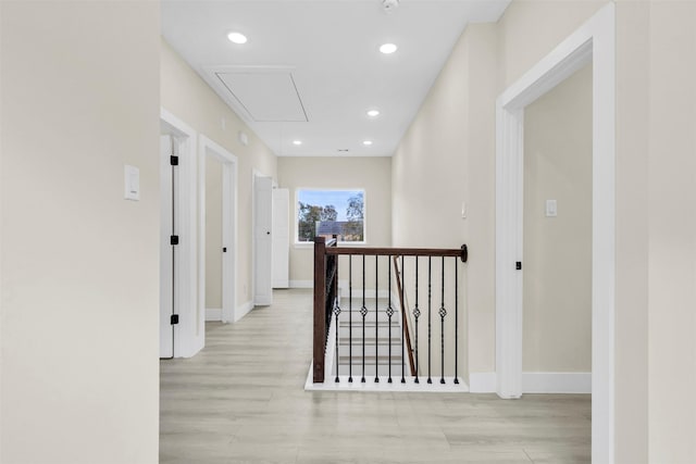 4908 Broom St, Houston, TX 77091 - hallway with attic access, light wood-style flooring, baseboards, and recessed lighting