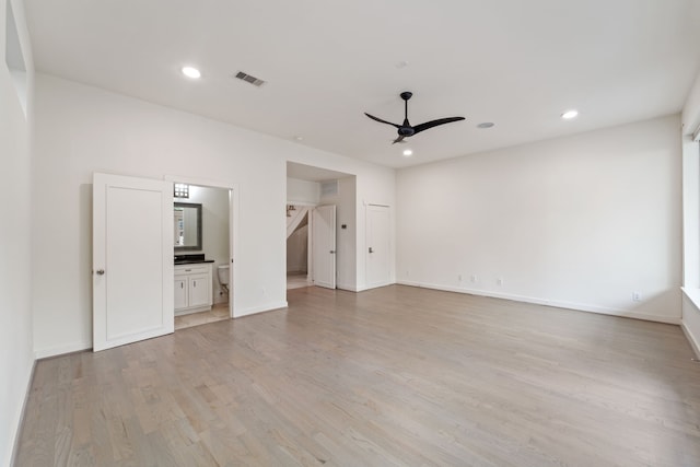 6217 Westcott St Unit B, Houston, TX 77007 - unfurnished bedroom featuring light wood finished floors, recessed lighting, ensuite bath, baseboards, and a ceiling fan