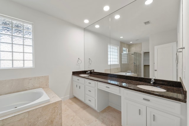 6217 Westcott St Unit B, Houston, TX 77007 - full bathroom featuring a stall shower, double vanity, a garden tub, recessed lighting, and tile patterned floors