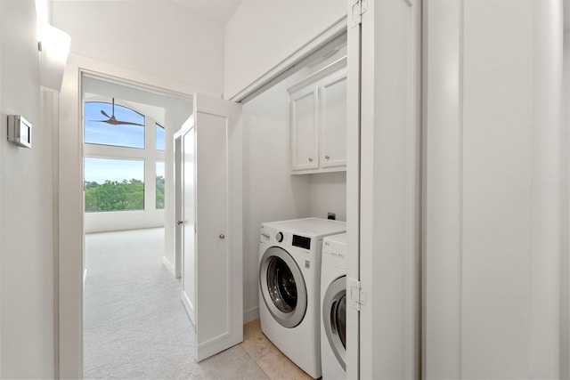 6217 Westcott St Unit B, Houston, TX 77007 - laundry area with cabinet space, washer and clothes dryer, and light carpet