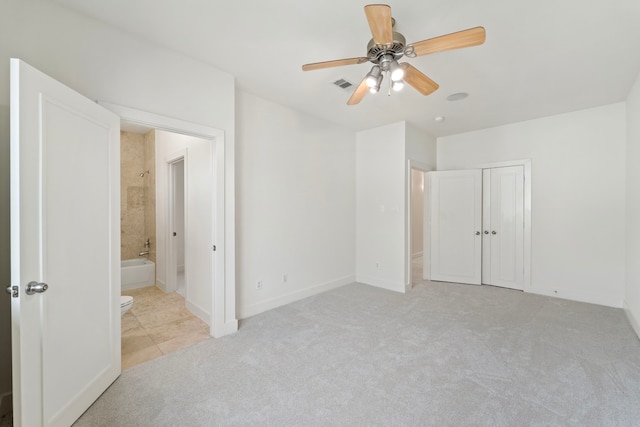 6217 Westcott St Unit B, Houston, TX 77007 - unfurnished bedroom with light carpet, ensuite bathroom, baseboards, ceiling fan, and a closet