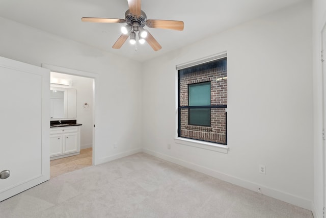 6217 Westcott St Unit B, Houston, TX 77007 - unfurnished bedroom with light carpet, a sink, baseboards, and ensuite bath