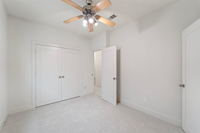 6217 Westcott St Unit B, Houston, TX 77007 - unfurnished bedroom with light carpet, baseboards, ceiling fan, and a closet