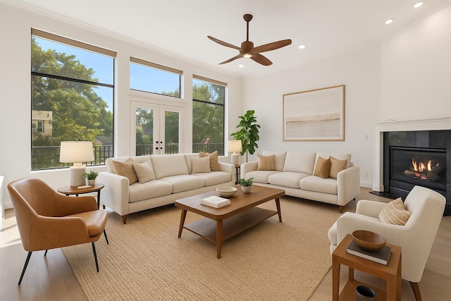 6217 Westcott St Unit B, Houston, TX 77007 - living area featuring a ceiling fan, french doors, recessed lighting, a glass covered fireplace, and light wood-type flooring