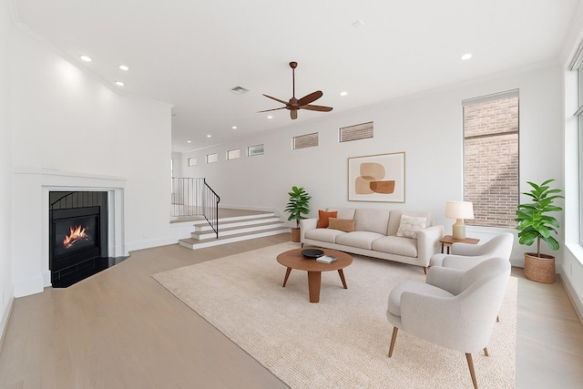 6217 Westcott St Unit B, Houston, TX 77007 - living room with light wood finished floors, recessed lighting, ceiling fan, baseboards, and stairway