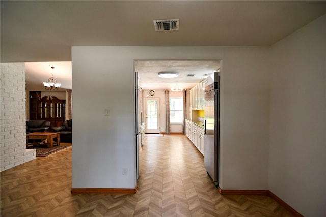 2106 Silver Falls Dr, Houston, TX 77339 - corridor with baseboards and a chandelier