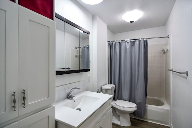 2106 Silver Falls Dr, Houston, TX 77339 - bathroom featuring vanity, toilet, wood finished floors, and shower / bath combination with curtain