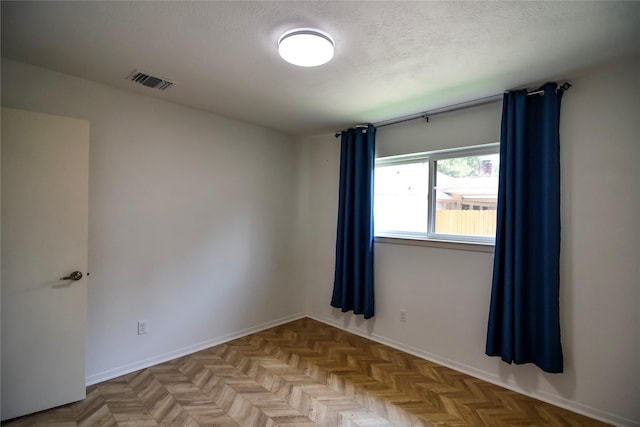 2106 Silver Falls Dr, Houston, TX 77339 - spare room with baseboards and a textured ceiling