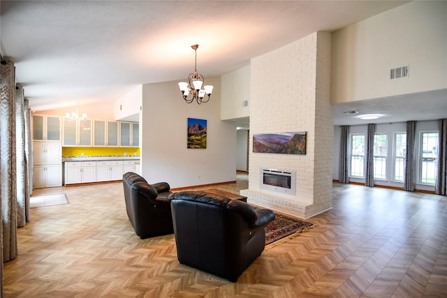 2106 Silver Falls Dr, Houston, TX 77339 - living room with a chandelier, high vaulted ceiling, a fireplace, and baseboards