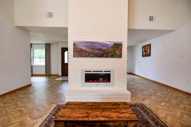 2106 Silver Falls Dr, Houston, TX 77339 - unfurnished living room with baseboards, a high ceiling, and a brick fireplace