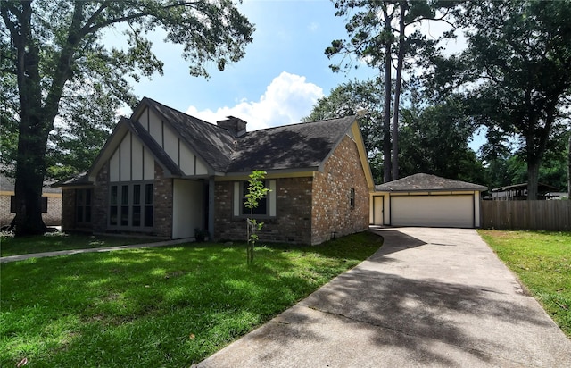 2106 Silver Falls Dr, Houston, TX 77339 - tudor home with brick siding, a detached garage, a shingled roof, and an outbuilding