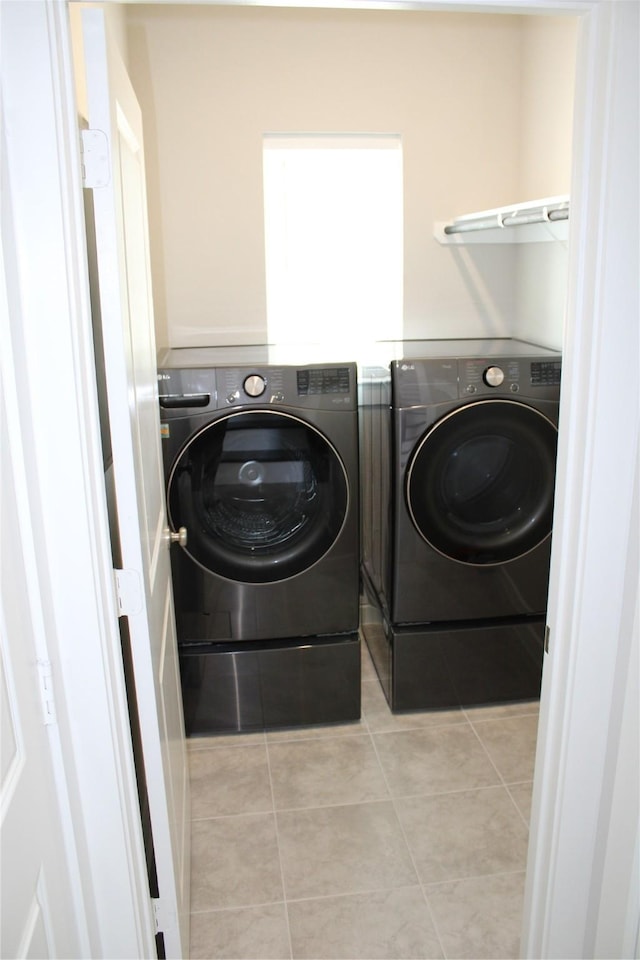 143 Nightshade St, Richmond, TX 77406 - washroom featuring independent washer and dryer and light tile patterned floors