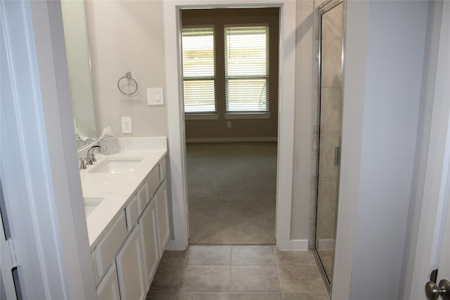 143 Nightshade St, Richmond, TX 77406 - full bath featuring double vanity, an enclosed shower, tile patterned floors, and baseboards