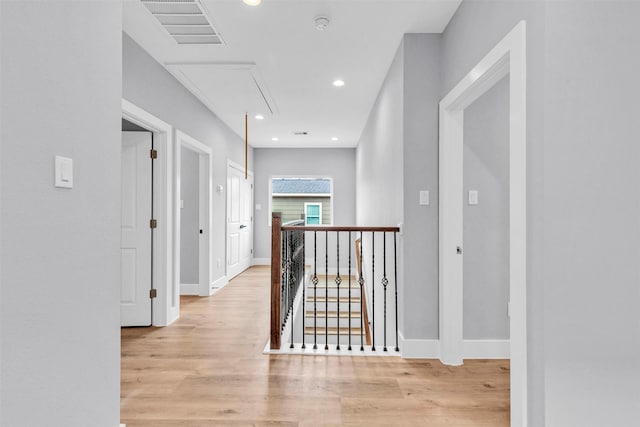 5029 Creekmont Dr, Houston, TX 77091 - corridor with attic access, light wood-style flooring, baseboards, an upstairs landing, and recessed lighting