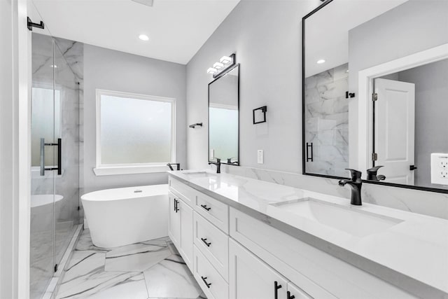 5029 Creekmont Dr, Houston, TX 77091 - bathroom featuring a marble finish shower, double vanity, a freestanding tub, and recessed lighting