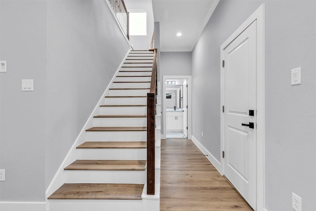 5029 Creekmont Dr, Houston, TX 77091 - stairs with wood finished floors, recessed lighting, and baseboards
