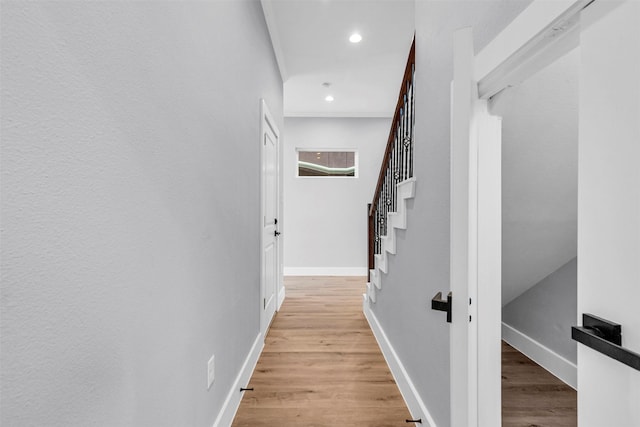 5029 Creekmont Dr, Houston, TX 77091 - hall with light wood-style floors, baseboards, recessed lighting, and stairway