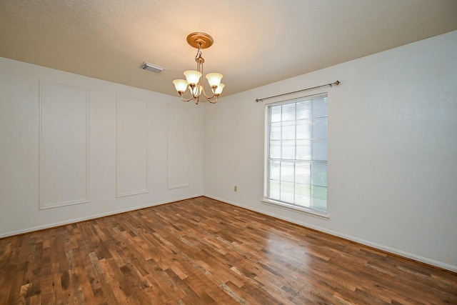 19515 Oak Timbers Dr, Humble, TX 77346 - spare room featuring a chandelier, wood finished floors, and baseboards